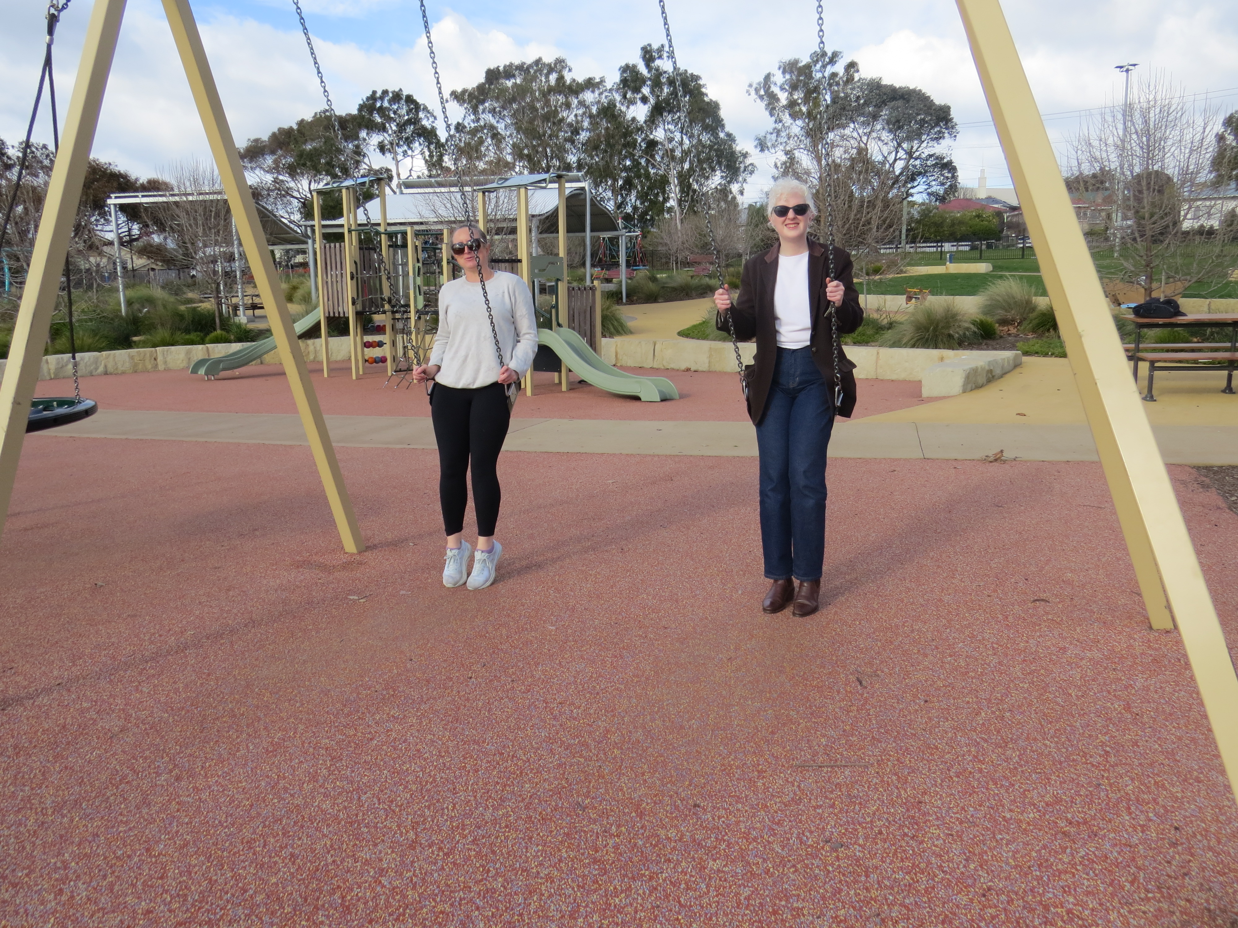 Mim and Savannah on the swings